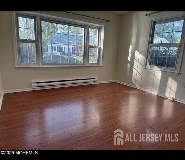 655 Yale Way Unit A, Monroe, NJ 08831 - empty room with a baseboard radiator, wood finished floors, and baseboards
