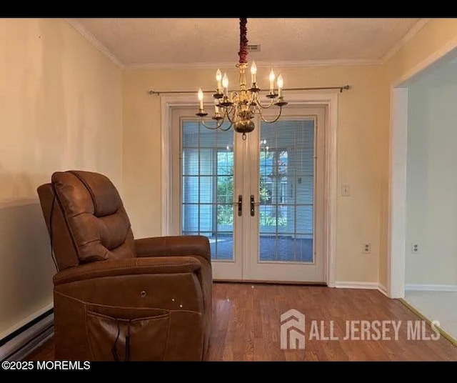 655 Yale Way Unit A, Monroe, NJ 08831 - entryway featuring baseboard heating, a chandelier, wood finished floors, french doors, and crown molding