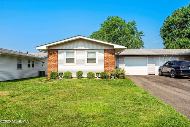 8 Constable St, Brick, NJ 08724 - single story home featuring brick siding, a garage, aphalt driveway, a front yard, and central air condition unit