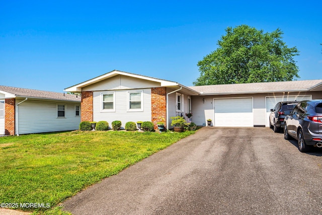 8 Constable St, Brick, NJ 08724 - ranch-style house with an attached garage, a front yard, and aphalt driveway
