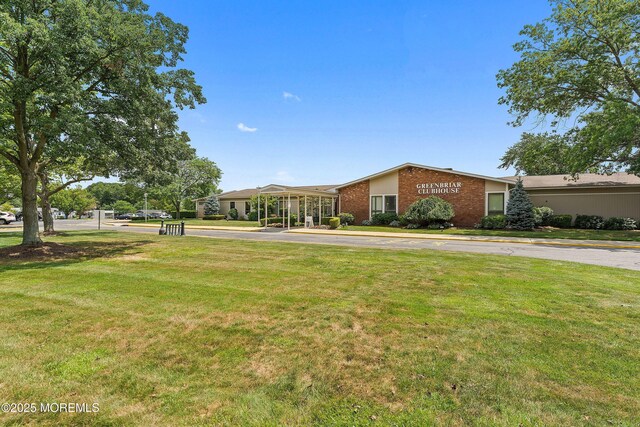 8 Constable St, Brick, NJ 08724 - view of front of house with brick siding and a front yard
