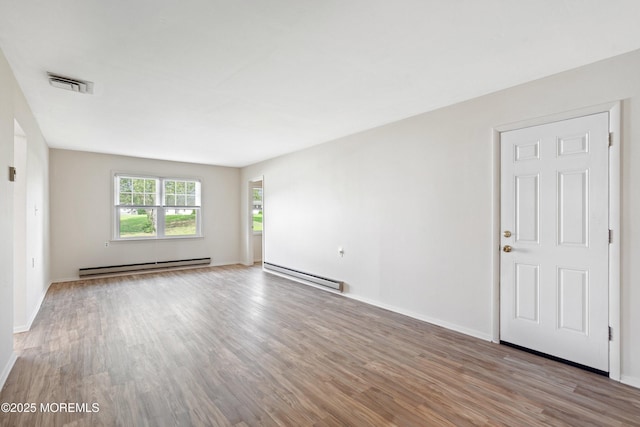 8 Constable St, Brick, NJ 08724 - spare room with wood finished floors, a baseboard radiator, and baseboard heating