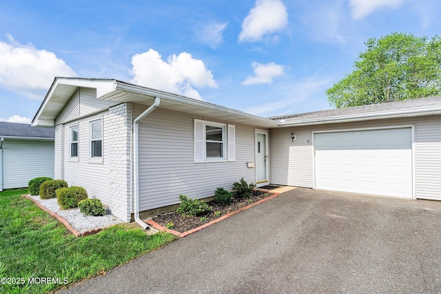 8 Constable St, Brick, NJ 08724 - ranch-style house with a garage, asphalt driveway, and brick siding