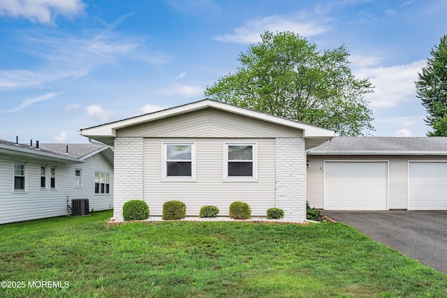 8 Constable St, Brick, NJ 08724 - ranch-style house featuring asphalt driveway, brick siding, a front lawn, and a garage