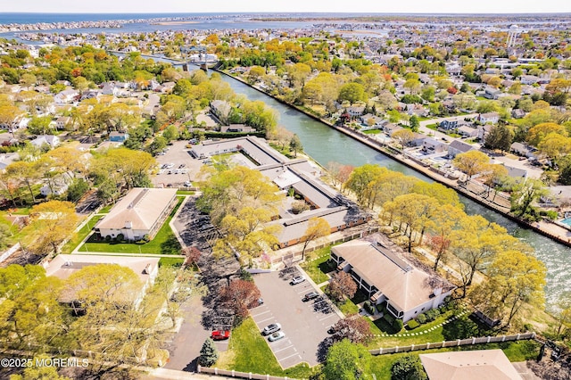 bird's eye view featuring a water view and a residential view