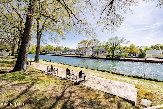 view of home's community featuring a water view, fence, and a residential view