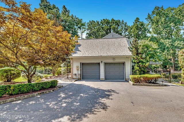 garage featuring fence
