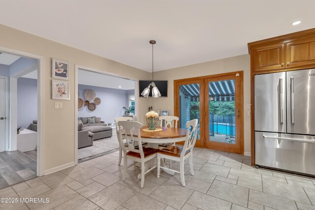 dining area featuring baseboards and recessed lighting