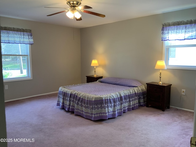 bedroom with baseboards, carpet, and a ceiling fan