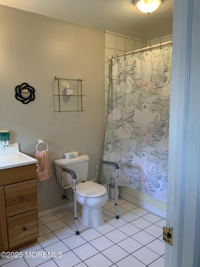 bathroom featuring toilet, baseboards, tile patterned flooring, and vanity