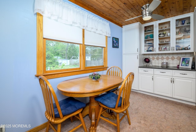 dining room with a ceiling fan and wood ceiling