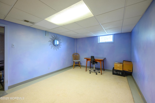 office space with carpet floors, visible vents, baseboards, and a paneled ceiling