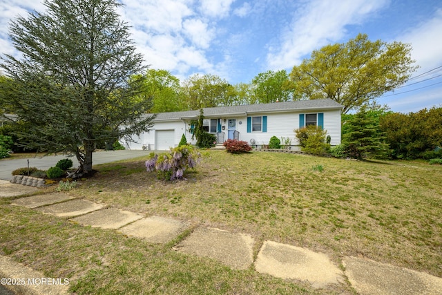 ranch-style house with an attached garage, a front lawn, and driveway
