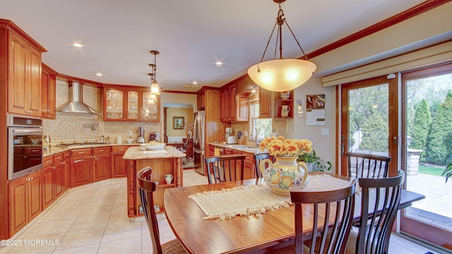 dining area featuring light tile patterned flooring, recessed lighting, and ornamental molding