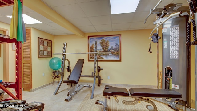 exercise room featuring a paneled ceiling
