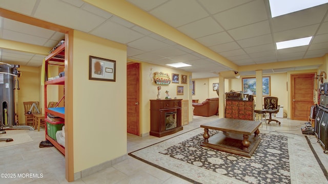 living room featuring a drop ceiling