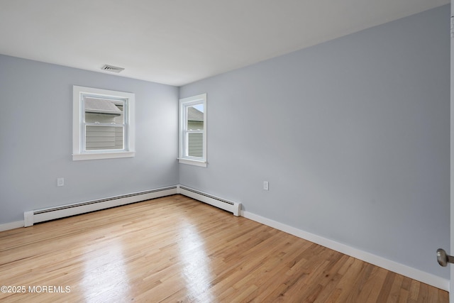 82 Fox Glove, Toms River, NJ 08755 - unfurnished room featuring baseboards, a baseboard radiator, visible vents, and wood finished floors