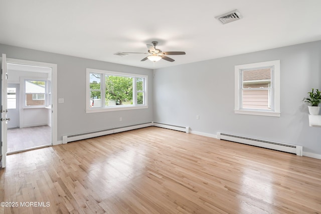 82 Fox Glove, Toms River, NJ 08755 - unfurnished room with a baseboard heating unit, a healthy amount of sunlight, and ceiling fan