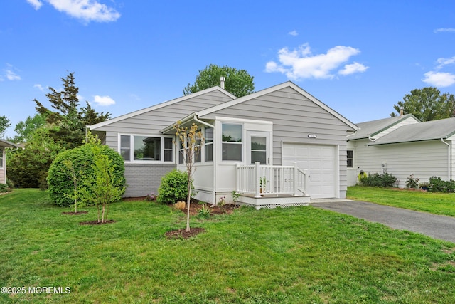 82 Fox Glove, Toms River, NJ 08755 - ranch-style house featuring a front lawn, brick siding, aphalt driveway, and an attached garage