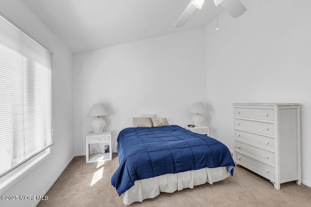 bedroom with ceiling fan, baseboards, and carpet