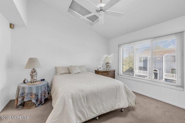 bedroom featuring a ceiling fan, baseboards, carpet, and vaulted ceiling