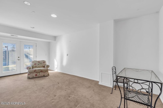 sitting room featuring french doors, carpet, recessed lighting, baseboards, and visible vents