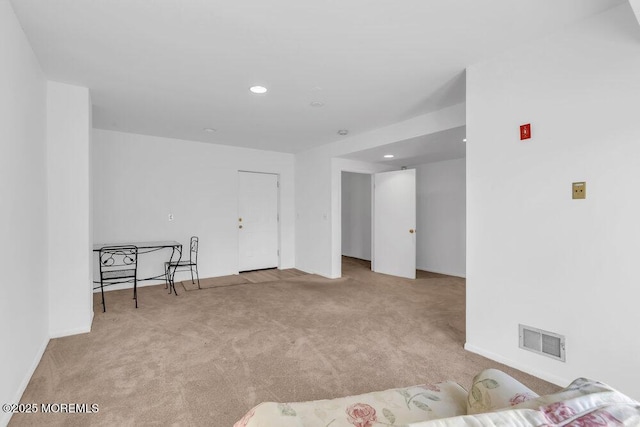 unfurnished room featuring baseboards, carpet, recessed lighting, and visible vents