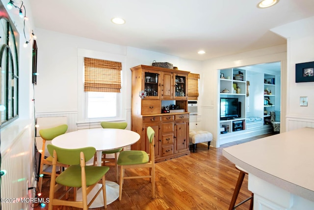 dining space with light wood-style floors and recessed lighting