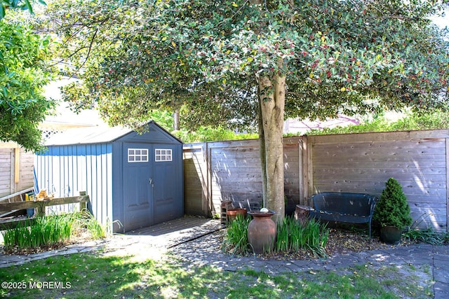 view of shed with a fenced backyard