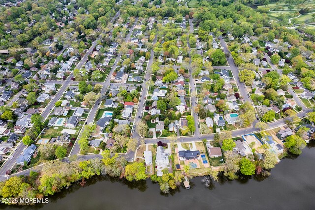 bird's eye view featuring a water view and a residential view