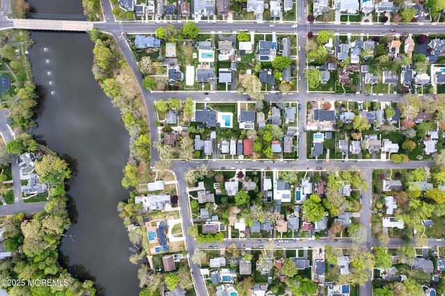 aerial view featuring a residential view and a water view