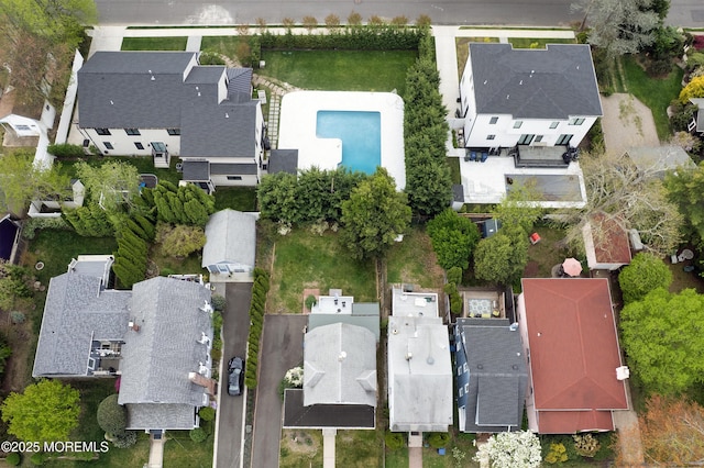 birds eye view of property with a residential view