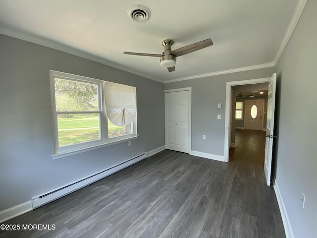 unfurnished bedroom featuring dark wood-style flooring, visible vents, baseboards, a baseboard radiator, and ornamental molding