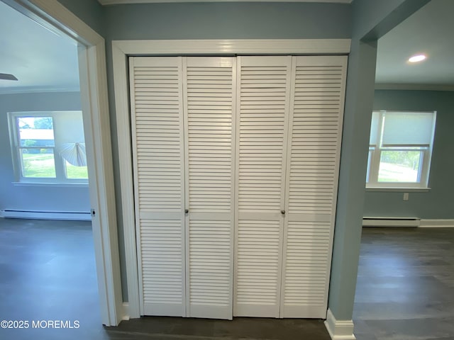 room details featuring ornamental molding, baseboards, baseboard heating, recessed lighting, and a baseboard heating unit