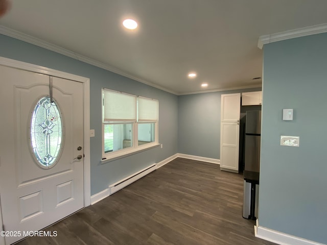 entrance foyer featuring dark wood finished floors, baseboards, a baseboard heating unit, ornamental molding, and recessed lighting