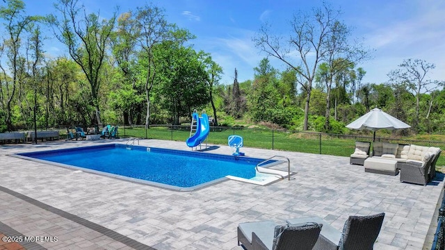 115 Phalanx Rd, Colts Neck, NJ 07722 - view of swimming pool with fence, a water slide, a fenced in pool, an outdoor living space, and a patio area
