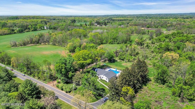 115 Phalanx Rd, Colts Neck, NJ 07722 - drone / aerial view featuring a wooded view