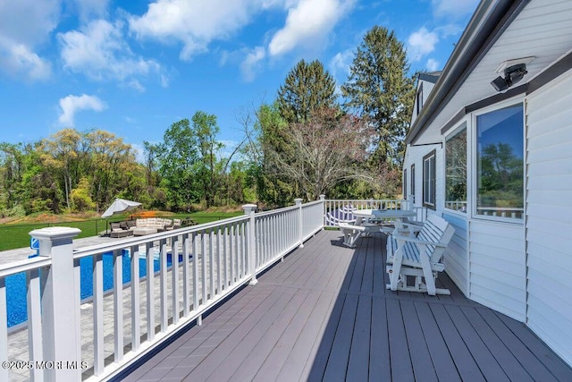 115 Phalanx Rd, Colts Neck, NJ 07722 - wooden terrace featuring an outdoor pool and outdoor dining space