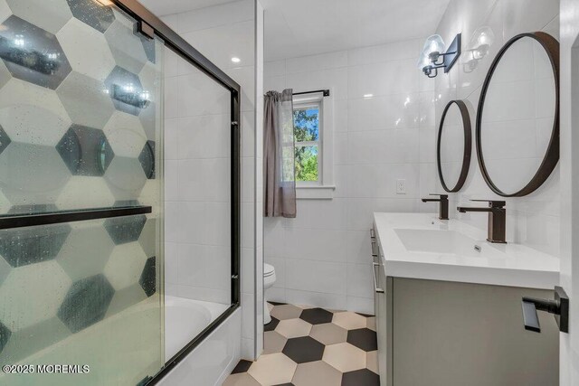 115 Phalanx Rd, Colts Neck, NJ 07722 - bathroom featuring enclosed tub / shower combo, toilet, tile walls, and vanity