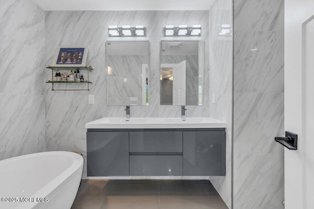 115 Phalanx Rd, Colts Neck, NJ 07722 - full bathroom featuring double vanity, a sink, a freestanding tub, and tile walls