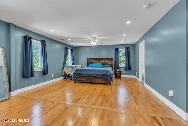 115 Phalanx Rd, Colts Neck, NJ 07722 - bedroom featuring baseboards, multiple windows, and light wood-style flooring