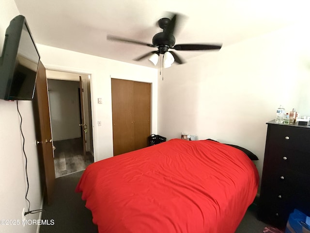 bedroom with ceiling fan and a closet