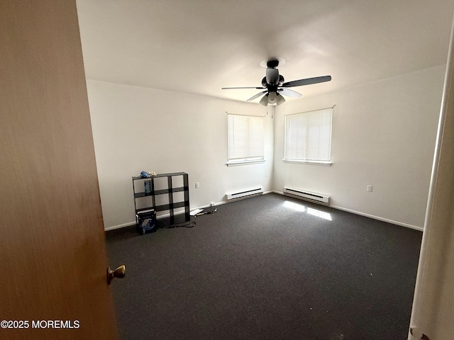 empty room with a ceiling fan, baseboards, baseboard heating, and dark colored carpet
