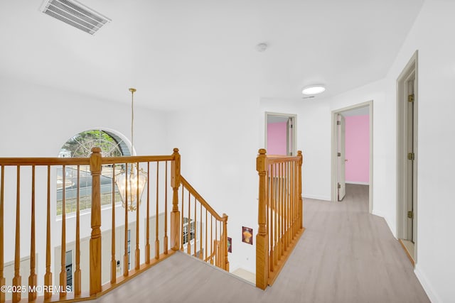 65 Mill Pond Rd, Jackson, NJ 08527 - hall with baseboards, an upstairs landing, wood finished floors, and visible vents