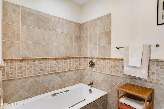 full bathroom featuring a relaxing tiled tub, tile walls, and tiled shower