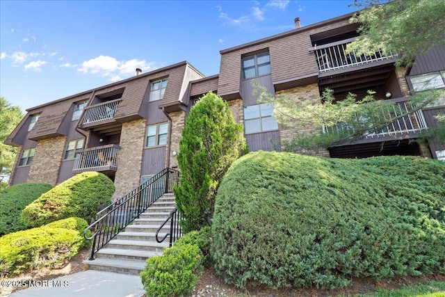 view of property featuring stairs
