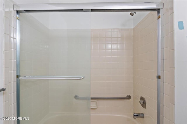 full bathroom featuring combined bath / shower with glass door