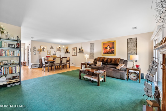 living room with visible vents and wood finished floors