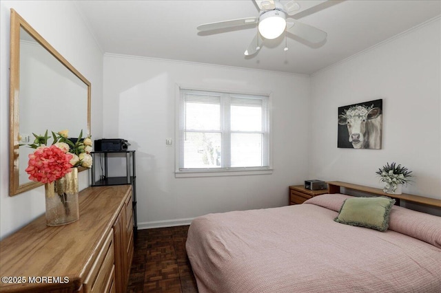 bedroom with crown molding, a ceiling fan, and baseboards