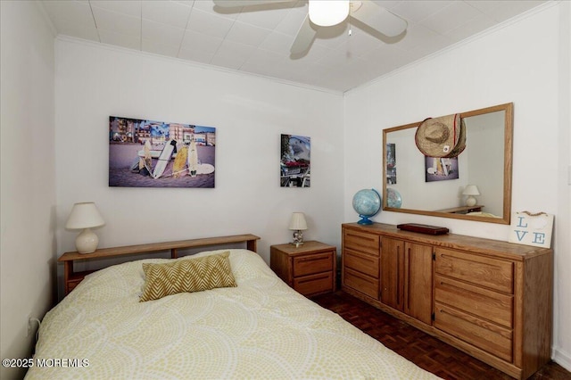 bedroom with crown molding and ceiling fan